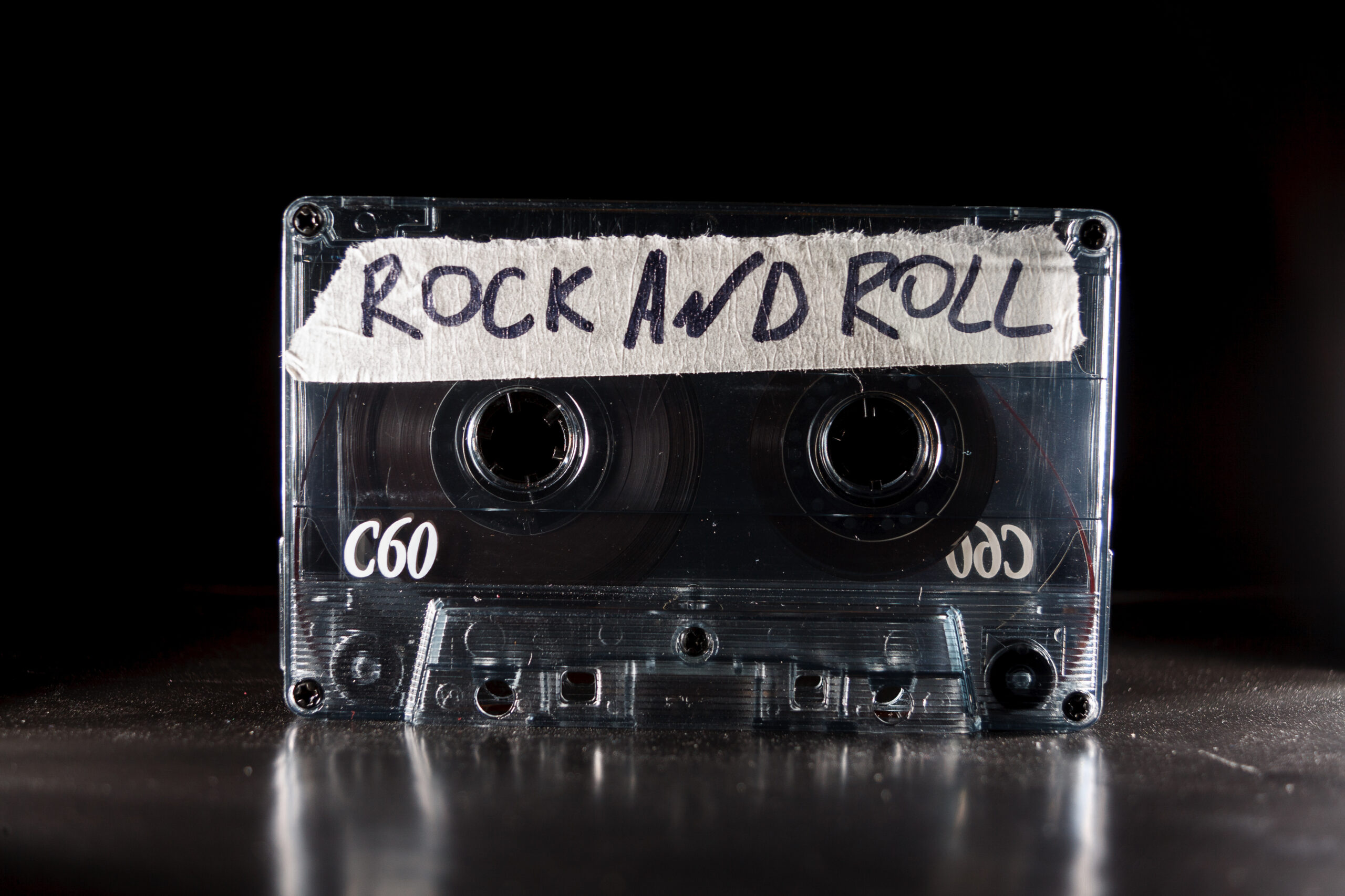 a casette player with "rock and roll" written on tape to label it